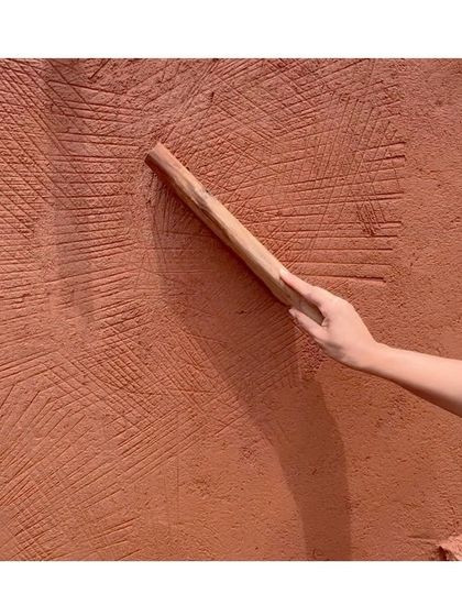 The 'Thappi' tool gives this Rajasthani lime plaster technique its name. The gentle beating action helps the lime set, improves adhesion, and creates a distinctive textured finish.