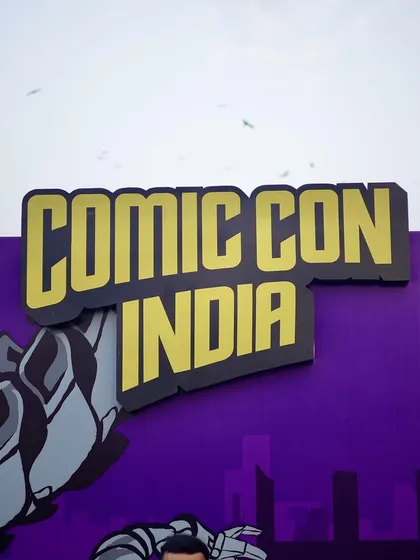 The official Comic Con India sign, a simple but essential shot for establishing the event's brand and location.