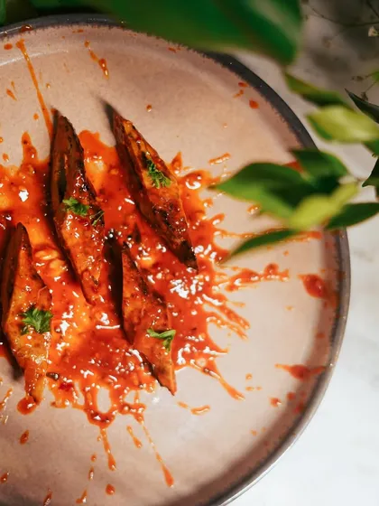 A closer look at the Mutton Dardari Seekh. The abstract plating style adds a modern touch to this traditional and flavorful dish.
