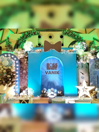 A detailed shot of the "Boss Baby" stage, showcasing the creative use of arches, props, and lighting to create a memorable centerpiece.