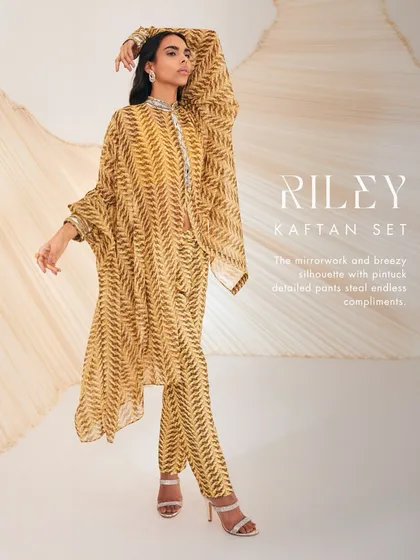 A stylized shot of the Riley Kaftan Set, highlighting the mirrorwork and breezy silhouette.