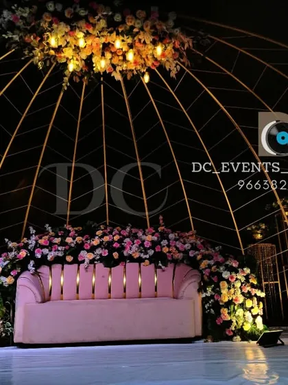 This is one of our signature large scale reception stages. The elegant dome structure, adorned with lush floral arrangements, creates a breathtaking and luxurious focal point for any grand celebration.