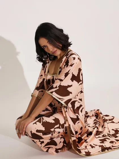 A floor-level shot of a printed kaftan-style co-ord set. This angle showcases the relaxed drape of the fabric and the overall comfort of the look.