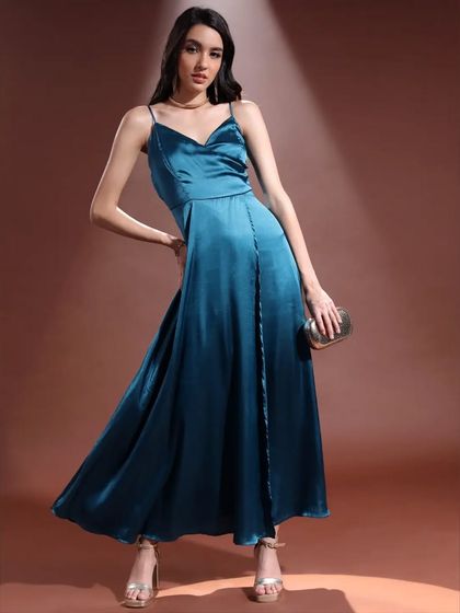 This pose shows the full silhouette of the teal satin gown. It’s a perfect example of how I style and direct for lookbooks that need to be both beautiful and informative.