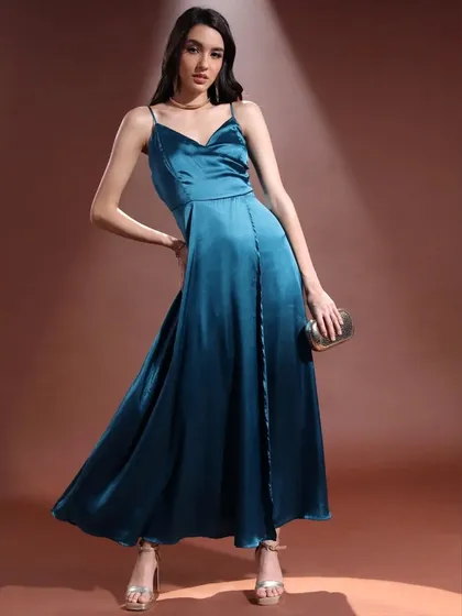 This pose shows the full silhouette of the teal satin gown. It’s a perfect example of how I style and direct for lookbooks that need to be both beautiful and informative.