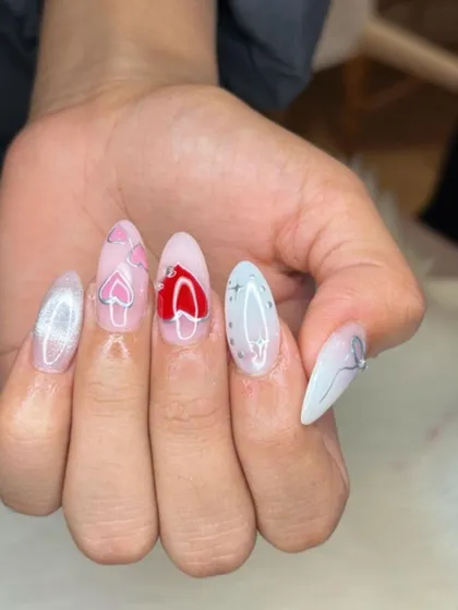 A playful combination of cat eye and chrome, featuring heart designs in red and pink.