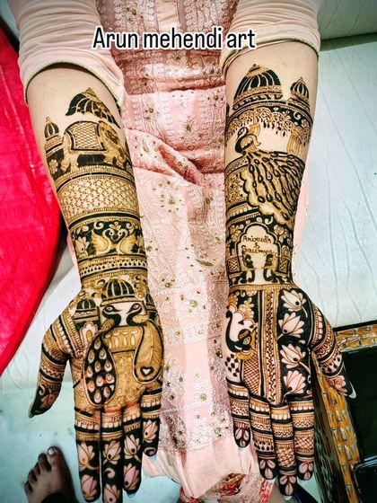 A design filled with a variety of auspicious motifs, including elephants, peacocks, and a kalash.