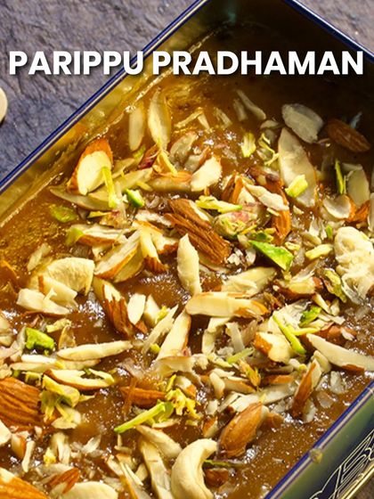 A close-up of my Parippu Pradhaman, served in our signature tin box and topped with slivered nuts.