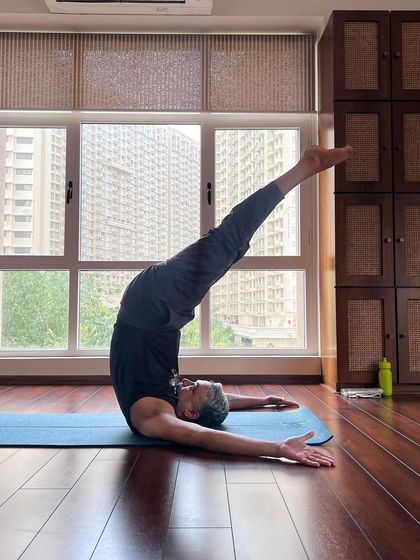 A student finds joy in Viparita Chakrasana (Upward-Facing Two-Foot Staff Pose), an inversion that calms the nervous system and strengthens the spine.