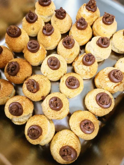 A tray of our artisanal choux pastries, filled with a rich chocolate cream. These were part of a large Diwali catering order and are one of my favorite things to make.