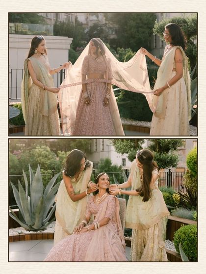 A sweet, candid moment between the bride and her bridesmaids. They help adjust her veil, their actions showing the care and love that surrounds her on her wedding day.