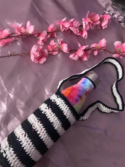 A different angle of the black and white crochet bottle cover. I can make these in any striped color combination you want.