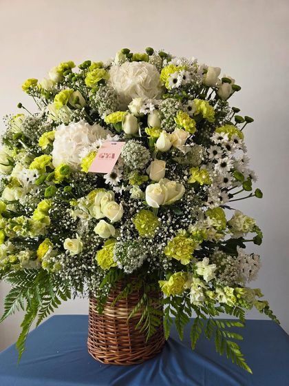 This angle shows the height and volume of the magnificent floral basket, perfect for making a grand statement.