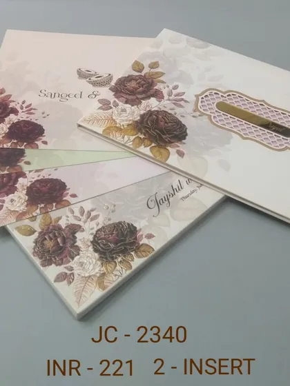 A lovely invitation with a print of deep red and purple roses. The design is rich and romantic, perfect for an autumn or winter wedding.