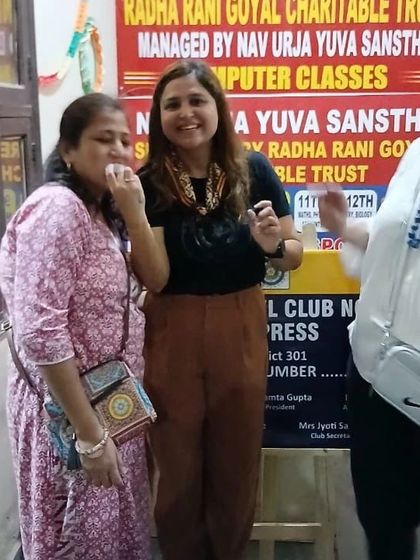 Sharing a lighthearted moment during the celebration. Building rapport and trust is key to effective community work.