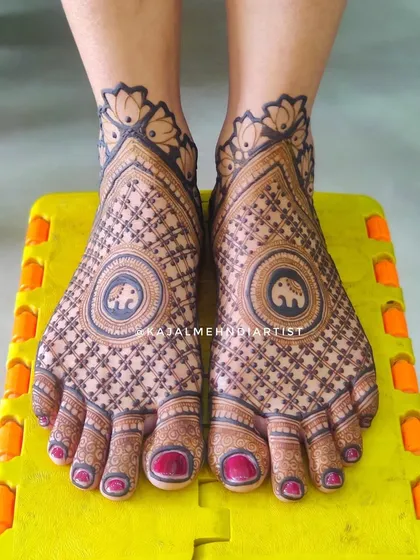 This design features adorable elephant motifs within a mandala on the feet, surrounded by intricate grid work.