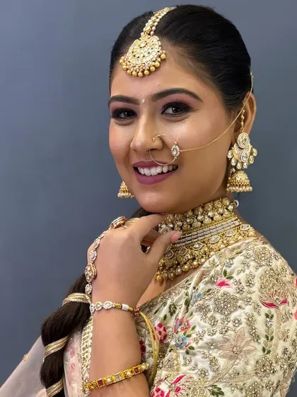 A close-up of Avani's makeup, highlighting her bright smile and beautiful eyes.