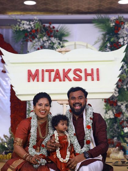 A beautiful family portrait captured after the name reveal. The joy on their faces is a testament to a perfectly executed celebration.