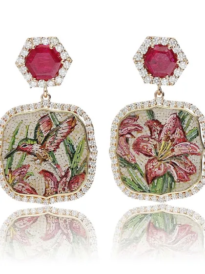I love designing asymmetrical earrings that tell a story. This pair, named "The Promise of Eden," features a hummingbird on one side and a lily on the other, both crafted in micromosaic and set with a halo of diamonds and hexagonal rubies.