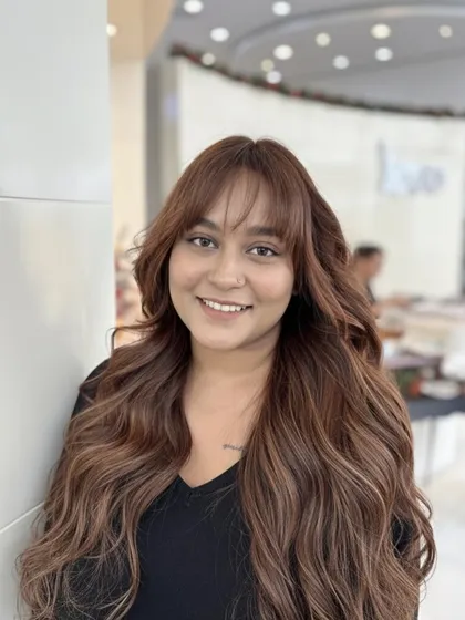 This smiling shot perfectly captures the elegance of this custom chestnut brown blend. The color is rich and glossy, and the bangs frame her face perfectly.