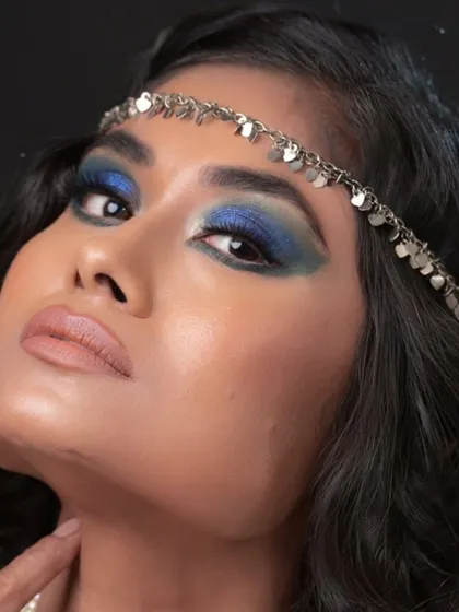 A dramatic blue smokey eye look. I teach students how to work with bold colors confidently.
