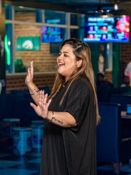 The fun isn't just about watching the game. As the night goes on, the music gets going and the dance floor fills up. Here's a guest enjoying the party vibe.