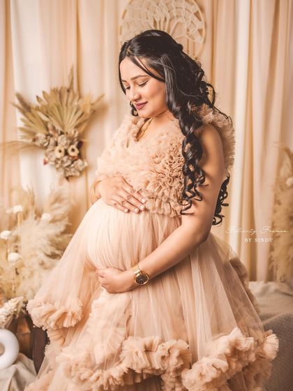 A close-up of our dramatic Paige gown. The layers of nude-colored ruffles create incredible texture and a high-fashion feel.