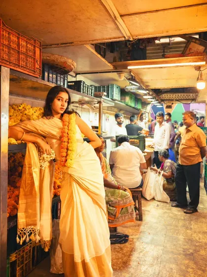 I love the contrast of high fashion in everyday places. Here, we created a striking editorial moment with a traditional saree amidst the beautiful chaos of a Mumbai flower market.