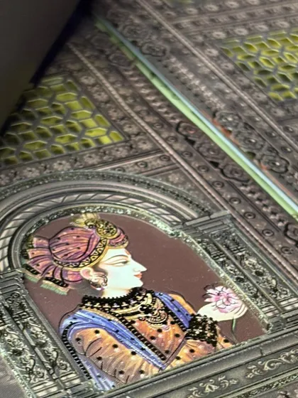 A close-up of the intricate jali work and miniature portrait details from one of my heritage-inspired designs.