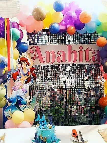 A beautiful Disney Princess theme for Anahita's birthday. The colorful setup includes Ariel and a rainbow arch over a shimmering backdrop, perfect for any little princess.