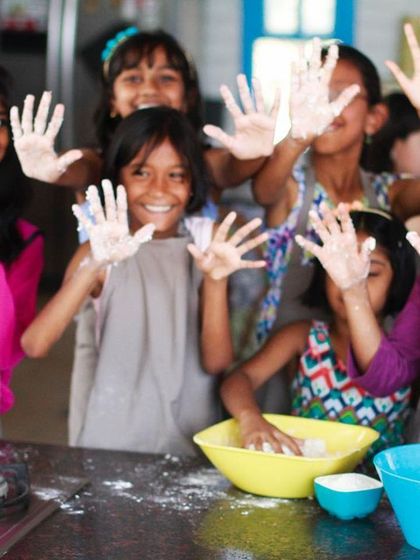 Another shot of our happy, flour-dusted chefs. These hands-on moments are where the real learning and fun happen.