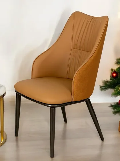 Bring home this lounge chair for a cozy corner or as a stylish dining chair. It features superior comfort with high-quality cushioning and a luxurious tan leather finish, perfect for long conversations around the table.