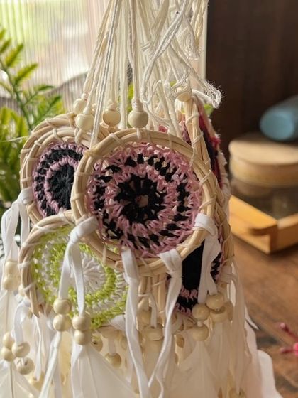 Our special cane and crochet dreamcatchers, featuring delicate feathers and wooden beads. These are traditionally used to protect sleepers and make for a meaningful gift.