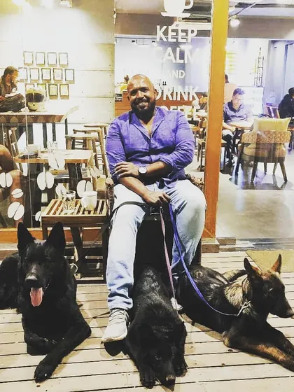This is the end goal. Enjoying a coffee in public, completely relaxed, with my squad of powerful, trained dogs at my feet. They aren't anxious or reactive; they are calm companions. This is the freedom and partnership that comes from real training and clear leadership.