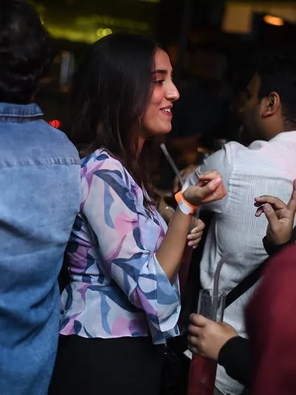 People chatting and connecting over drinks and good music.