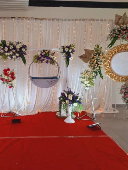 This view highlights the golden decorative frame and floral accents in this modern naming ceremony design.