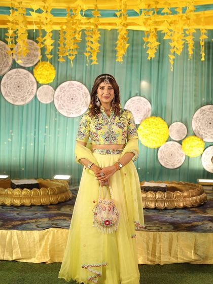 Here I am, all ready for a Haldi function. This is my personal take on a Haldi look, with natural makeup that works well with the bright yellow outfit and festive decor.