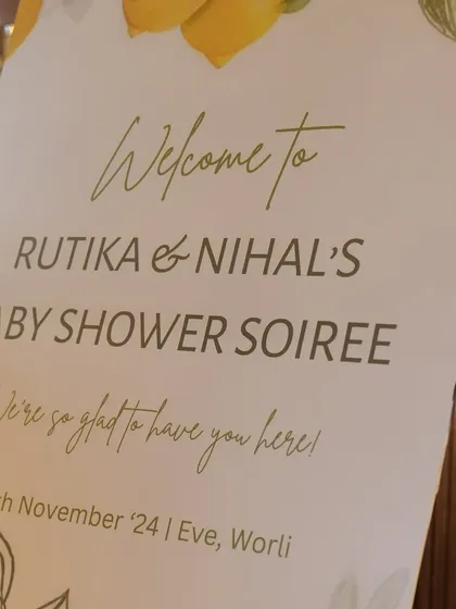 A close up of the elegant, custom welcome sign for Rutika and Nihal's baby shower, setting a sophisticated and personal tone for the event.