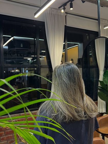 A still shot of the lived-in brown hair, showing the gentle transition of colors that makes this style so low-maintenance.