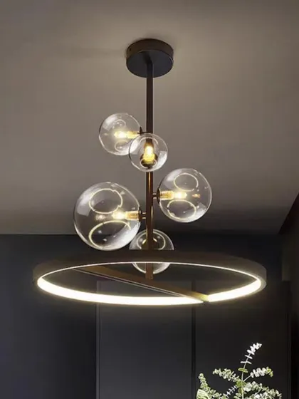 A contemporary chandelier combining a black ring with clear glass globes. This design offers a balanced mix of industrial and elegant styles.