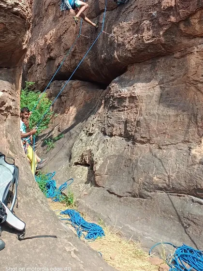 A typical setup at the crag in Badami. You can see the ropes, climbing gear, and climbers ready for a day of challenging sport climbing on the magnificent sandstone cliffs.