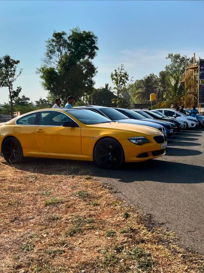 Another angle of the impressive lineup of cars, showing the variety of vehicles that attend our community gatherings.