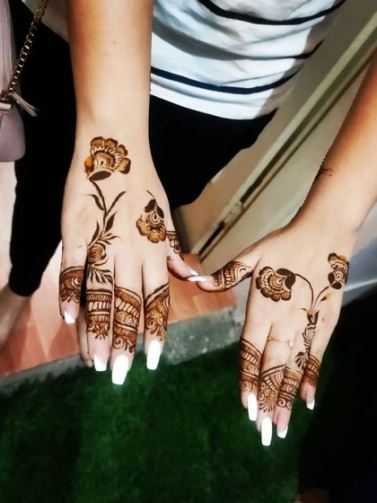 The same delicate floral vine design on a different client. It shows how a simple pattern can look beautiful on anyone.