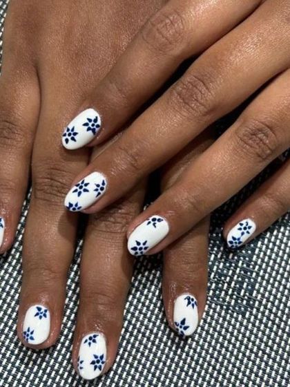 Another shot of the beautiful porcelain-inspired floral nails. The hand-painted pattern is delicate and precise.