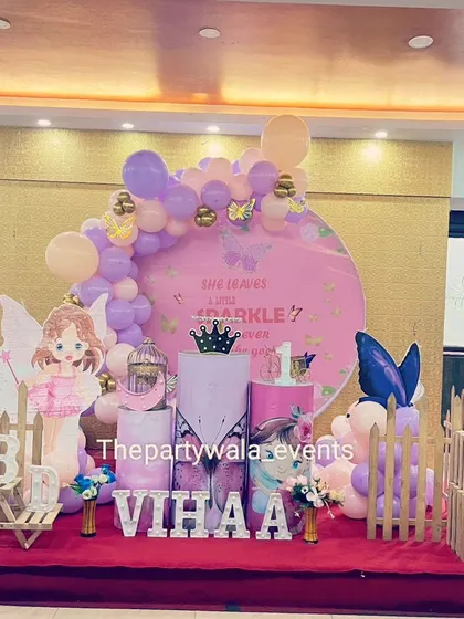 Another fairy tale theme on a stage, with a large backdrop and character cutouts. The red carpet adds a touch of royal elegance to the celebration.