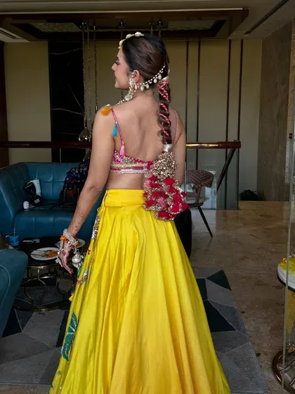 Another view of the complete Haldi ensemble. The vibrant colours and fresh makeup create a look that is full of life and energy.