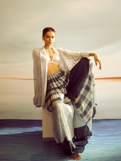 For this Voyce Jewellery campaign, we used a painted backdrop to create a serene, dreamlike atmosphere. The styling is layered and relaxed, with a focus on the turquoise necklace.