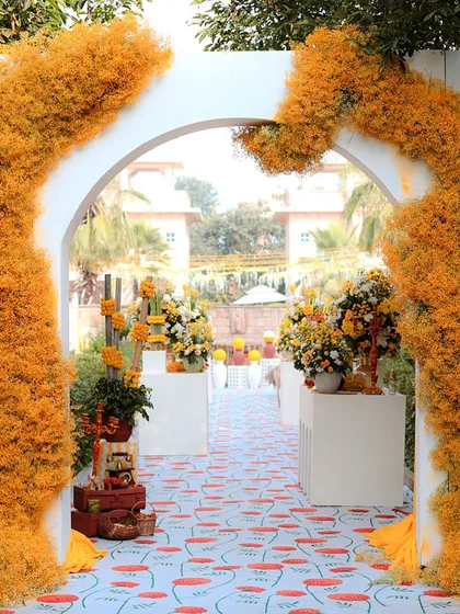 Another view of the floral arch entrance, showing how it creates a vibrant and welcoming gateway for the celebration.