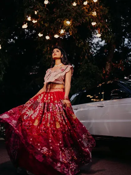 A beautiful, creative portrait. The upward angle and the lights in the trees create a magical atmosphere, and the bride's makeup looks perfect.