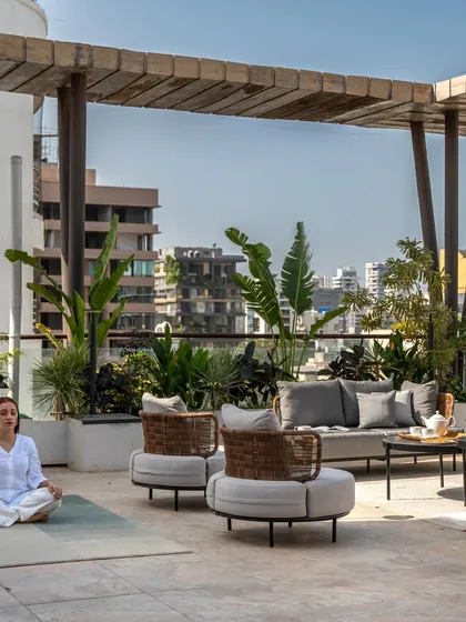 This shot captures a moment of tranquility on the spacious terrace. It's a space designed for pause and gathering, balancing the energy of the city with the calmness of a private retreat.